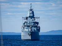 Missile Firing Exercise 2019 Frontal view of the frigate at sea, coastline in the background