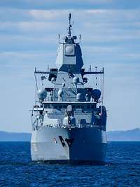 Missile Firing Exercise 2019 Frontal view of the frigate at sea, coastline in the background