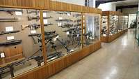 Display cases containing small arms