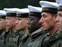 Bundeswehr soldiers of different origins stand in a row