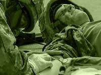 The mission of the Army Medical Service, like the mission of the Bundeswehr Medical Service, is to save the lives of military personnel and restore their health. A medical orderly applies an intravenous catheter to the arm of an injured fellow soldier lying on the ground.