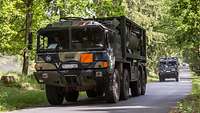 A tanker drives along a road.