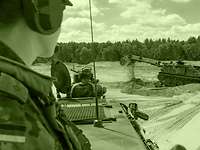 Engineers use special vehicles and machines A platoon leader observing the Dachs armoured engineer vehicle at work.