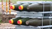 The six bomb heads in a metal rack