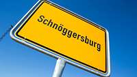 Ein Ortseingangsschild mit der Aufschrift „Schnöggersburg“