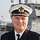 A navy officer in uniform.