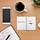 Symbolbild Stilleben Schreibtisch mit Tasse Kaffee, Laptop, Kalender und Smartphone 