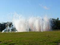 WTD 91 testing ROSY on palletized load system - building a smoke screen A smoke screen building up on a field in front of trees