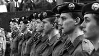 Black-and-white shot of the soldiers who stood up