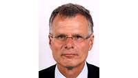 Wissenschaftlicher Direktor Dr. Joachim Kaltwang Portraitbild eines Mannes mit Brille