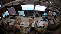 Soldiers sit at their work positions in the CRC