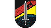 Das Wappen des ZCO beinhaltet ein Schwert vor dem Hintergrund einer Tastatur und einer Weltkugel.