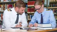 Two soldiers study together