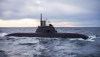 Surfaced submarine at sea.