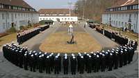 A number of soldiers lined up in a U-shaped formation.