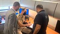 Three men having a meeting in an office