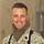 Chad McMeen Ein amerikanischer Soldat im Porträt vor einem ausgebombten Gebäude