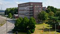 Large clinker-brick building located at a road