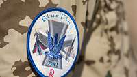 Blue Flag Zeichen an einem Uniformärmel mit der Aufschrift „Blue Flag“.