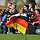 Fans der deutschen Mannschaft jubeln am Rande des Geschehens