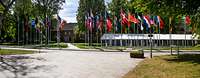 Flags of the countries participating in the CoC in front of a building of the Bundeswehr Command and Staff College