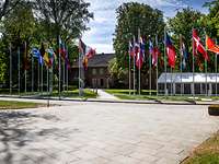 Flags of the participating countries Flags of the countries participating in the CoC in front of a building of the Bundeswehr Command and Staff College