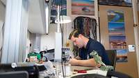 A man is working in his office