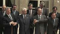 Die Präsidenten Bill Clinton, Boris Jelzin und François Mitterand