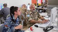 Two soldiers working together