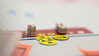 Game pieces and hazard signs lying on the game board