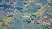 An A400M, eight fighter jets and a B1 fly over German farmland.