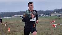 Oberstabsgefreiter Max-Lukas F. auf der Crosslaufstrecke am steilen Anstieg