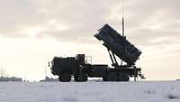 An anti-aircraft system is standing in the snow