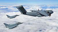 A transport aircraft refuels two combat aircraft in the air.