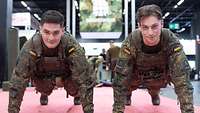 Zwei Soldaten im Liegestütz. Im Hintergrund ein großer grüner Würfel mit der Aufschrift Bundeswehr.