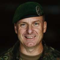 A portrait of a soldier with a beret