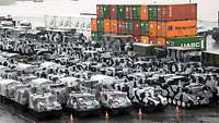 Several tracked vehicles at a port
