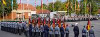 Soldiers lined up on a square, in the background, the flags of the 16 federal states are flying.