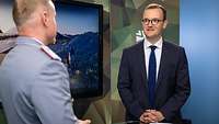 Ein Soldat und ein Mann stehen sich gegenüber und sprechen miteinander.