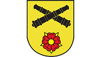 Zwei Kanonen, für die Artillerie, kreuzen sich auf goldenem Grund, darunter einer Lippische Rose.