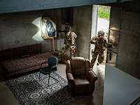 Special Operations Forces Command (SOFCOM) personnel enter a room
