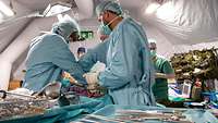 medical personnel in a tent