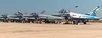 Six German Eurofighters side by side on an airfield.