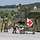 Medical forces provide medical care to a patient on a stretcher. Medical vehicle, mobile aid station with tent.