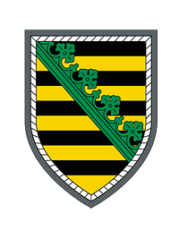 Wappen der Panzergrenadierbrigade 37 Neunfach schwarz und gold geteilt, belegt mit einem diagonalen grünen Rautenkranz, silbern umrandet.