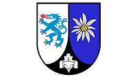 Rechts: blauer Drache auf Silber, links: Edelweiß auf Blau, Mitte: Pionierbrücke und Eichenblatt.